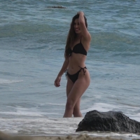 Sexy girl modeling on the beach