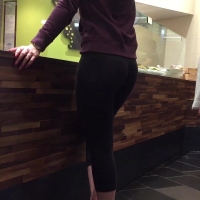 Girl in leggings getting some food