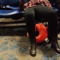 Airport girl in leggings spreading her crotch