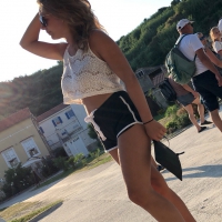 Girl out in crop top and showing some cheeks in little black shorts Girl in crop top and cheeky shorts