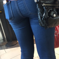 Hottie in line with a nice ass in tight jeans Hottie with nice ass in jeans