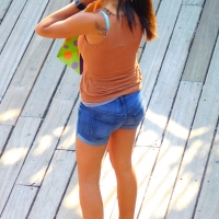 Bunch of candid babes in public in shorts 68843468@N04_24301412018_on the phone.jpg