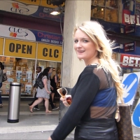 Hot blonde in mini skirt walking