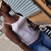 Braless black girl in a white s...