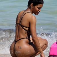 Sexy black babe in see through cheetah thong swimsuit Sexy black chick in thong swimsuit