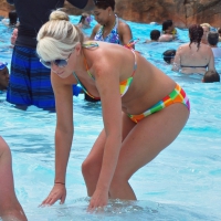 Blonde milf with a sexy body in bikini at the pool Blonde milf in bikini