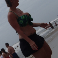 Big boobed blonde milf on the beach showing off her tits Big boobed milf on the beach