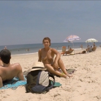 Sexy topless babe on the beach
