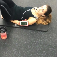 Sexy gym girl with a nice body in leggings as she works out Sexy gym girl in leggings