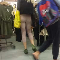 Skinny blonde girl shopping in light colored leggings Skinny blonde shopping in leggings
