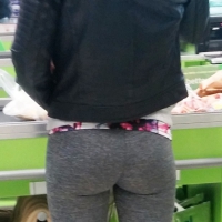 Skinny redhead shopping in grey leggings with a nice ass Skinny grey leggings ass