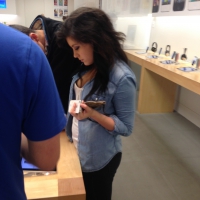 Brunette girl at an Apple store showing some cleavage and in jeans Brunette Apple girl cleavage