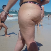 Fat ass milf at the beach in a thong bikini Fat ass milf in thong