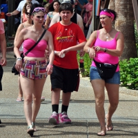 Mom and her brunette daughter walking in shorts Mom and daughter in shorts