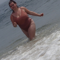 Fat chick in a swimsuit at the beach Fat chick in swimsuit