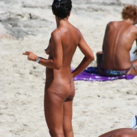 Smoking milf at a nude beach with a hairy pussy Smoking nude beach milf