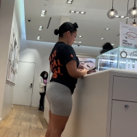 Latina in grey shorts