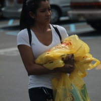 Beautiful ethnic babe walking in the parking lot after shopping Beautiful ethnic babe after shopping