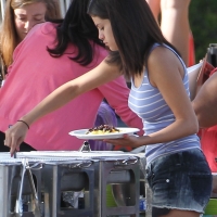 Selena Gomez getting some food braless and in shorts on the set of Spring Breakers 01.jpg