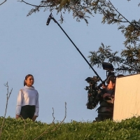 Vanessa Hudgens filming a sportswear ad in LA in tight green leggings 06.jpg