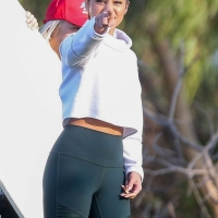 Vanessa Hudgens filming a sportswear ad in LA in tight green leggings 14.jpg