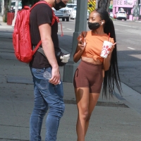 Skai Jackson at a dance studio in brown spandex shorts 01.jpg