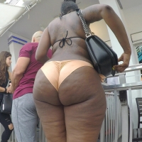 Candid ebony babe with a phat ass in a little orange bikini 784.mp4-2025-04-26-08h11m23s637.jpg