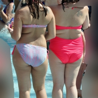 Two thick milfs at the pool in bikinis Thick milfs at the pool