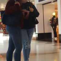 Cute college girl in tight jeans with nice booty at the mall Cute college girl at the mall
