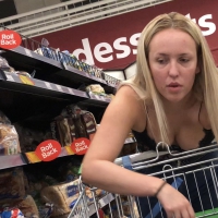 Walmart blonde slut shopping in jeans and an interesting top showing some boobage Walmart slut in interesting top