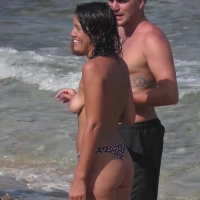Candid brunette lady showing her tits while topless and in a thong bikini at the beach sea-those-tits_4k.mp4-2026-05-01-09h32m29s203.jpg