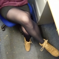 Coworker in short skirt and tight pantyhose up close Coworker in skirt and pantyhose