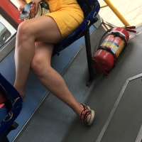 Girl in yellow shorts with sexy legs riding the bus Sexy legs on the bus