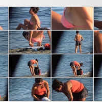 Milf in pink bikini on the beach