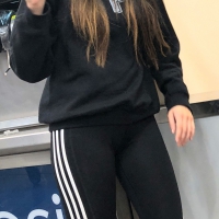 Beautiful brunette standing around in tight Adidas leggings Beautiful brunette in Adidas leggings