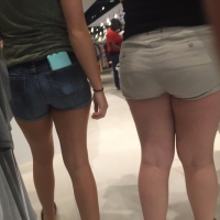 Blonde and brunette friends shopping in shorts with nice asses Blonde and brunette friends in shorts