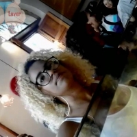 Curly haired Latina cleavage