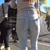 Sexy brunette teen in tight white jeans with friends