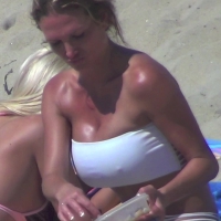 Girl with huge boobs on the beach