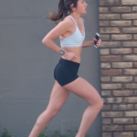Beautiful girl out for a run in spandex shorts Beautiful girl out running