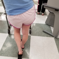 Nice blonde ass in athletic shorts while shopping Nice voyeur ass in running shorts