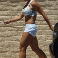 Fit babe in white shorts with big boobs in athletic top Fit babe in white shorts