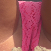 Super close up of a bikini teen laying out