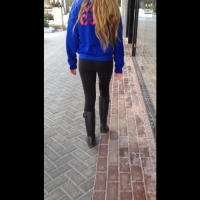 Petite blonde in black leggings