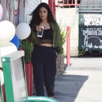 Vanessa Hudgens in some loose pants and showing a little belly at a gas station in Studio City Vanessa Hudgens at a gas station in Studio City 05/23/2016