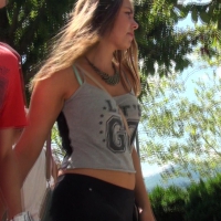 Beautiful teen in leggings walk behind