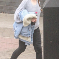 Pigtailed redhead walking in black leggings Pigtailed redhead