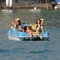 Babes stripping down to their bikinis on a paddle boat Paddle boat babes