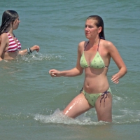 Milf at the beach in the water with hard nipples and a nice body Milf in the water