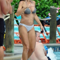 Sexy brunette lady with nice tits at the pool in a semi thong bikini Sexy brunette lady